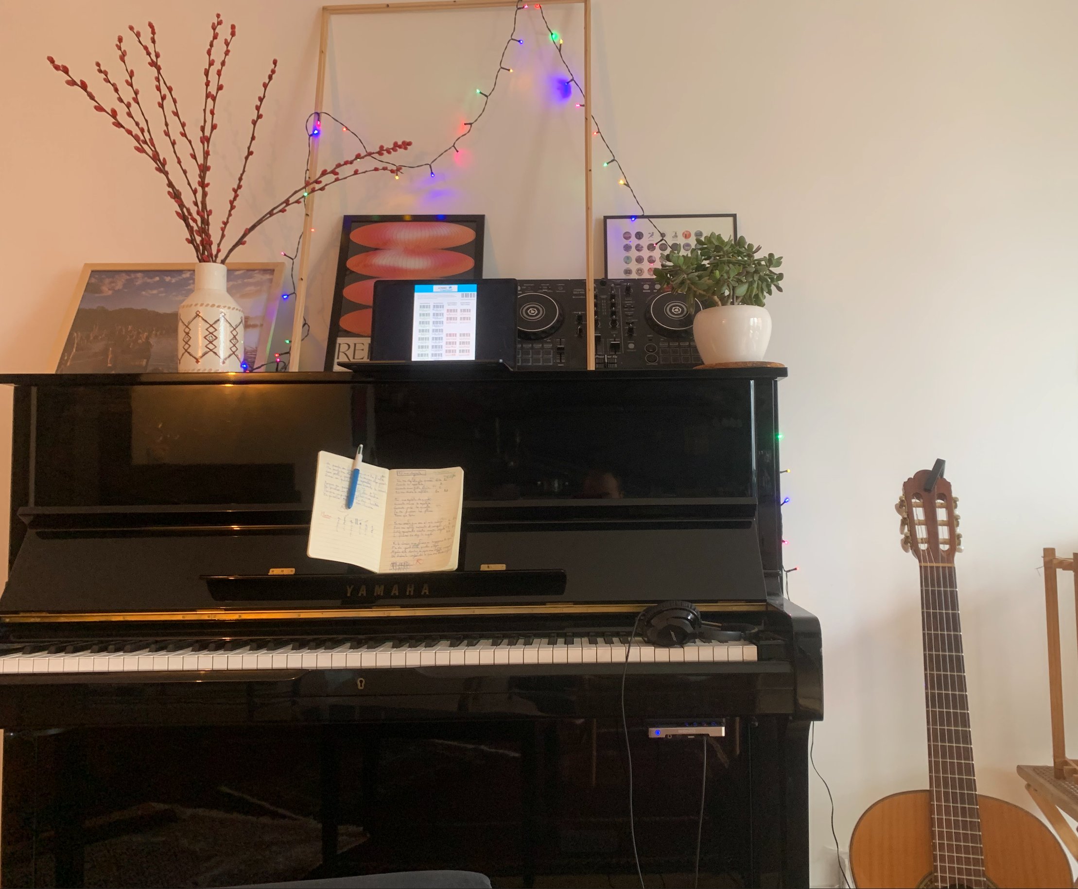 Piano with colorful mood lighting and DJ setup